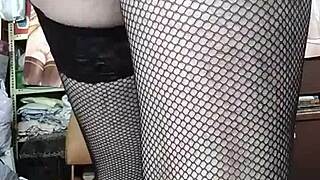 Transvestite in red thong poses sexily for amateurs