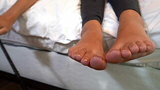 Giggles feet love rubbing all over a giant hot rock at the beach on beat2feetcom