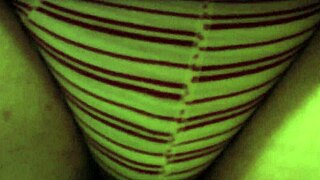 Peeing In Red Striped Underpants While Sitting On The Toilet