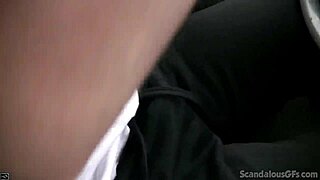 A young woman provides a handjob to a man while the man is in a car and recording