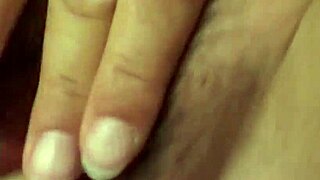 Blonde mature woman is masturbating with a toy but gets a fingering too
