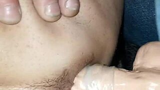 Wife stimulates her husband’s anus with a large sex toy heapqing his butt