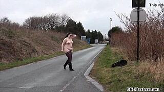 A crass BBW amateur Emma strips outdoors and is observed by a man who is a voyeur, she is a curvy chubby woman outdoors