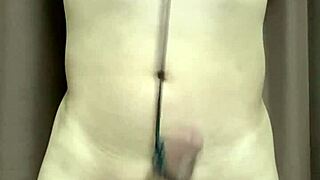 Hey, check out this anime guy tying his dick and balls with string!