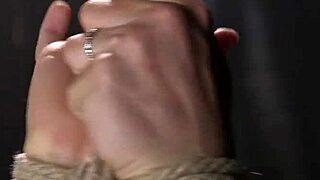 bound brunette experiences intense spanking session