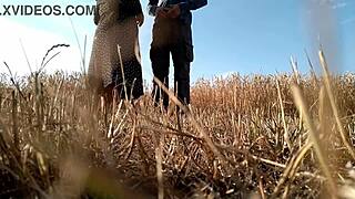 Sexy naked woman posing with big ass and tits in combination with a bureaucratic suit in the nature having oral sex
