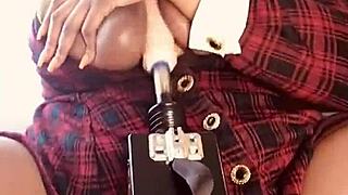 A big titty slut gets fucked by a machine