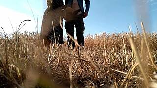 Sexy naked woman posing with big ass and tits in combination with a bureaucratic suit in the nature having oral sex