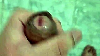 A rather thin young boy having a shower alone