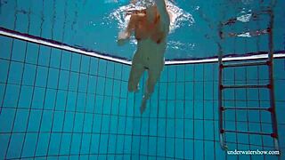 Slim and beautiful Deniska can’t help showing off her excellent endowment at the pool