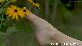 Young redhead teases sensually in outdoor close-ups.