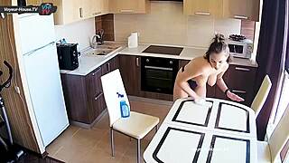 Wow, big tits beauty scrubbing kitchen counters topless! 😍