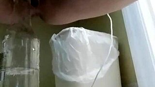 amateur couple experiments with bottle in bedroom