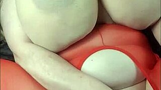 lady with huge tits lies back for fun with a big black cock toy.