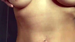 A sexy coed goes for groping her big breasts