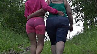 Teen MILF lesbians with huge, bushy butts dare go naked in a public park