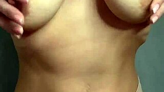 A hot student caresses her big tits solo