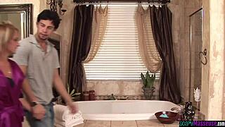 Inked masseuse tugging and sucking cock in shower