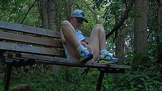 Blonde couple finds intense release in a quiet forest setting.