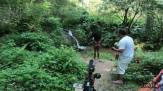 A young black woman shares her adventure along the river, taking pictures and making videos