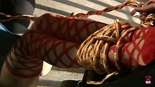 a brunette gets tied up in a threesome with stockings and bondage