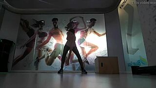 Cute blonde teen warms up at the gym.