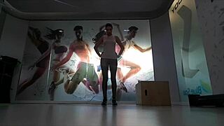 Cute blonde teen warms up at the gym.