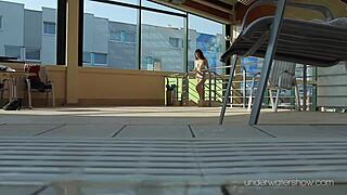 roxalana cheh, the sexy redhead, stuns while swimming underwater in a public spot.