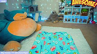 Cute nerdy goth girl plays with toys on webcam.