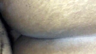 Bent over for doggystyle, her black ass shines in homemade action. It’s raw and real.