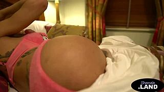 This busty trans blonde tugs her shaft solo with tattoos.