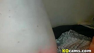 timid girl with hairy pussy masturbates and fingers on webcam at home.