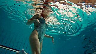 dasha submerged underwater in the pool