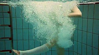 dasha submerged underwater in the pool