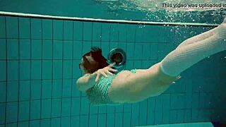 dasha submerged underwater in the pool