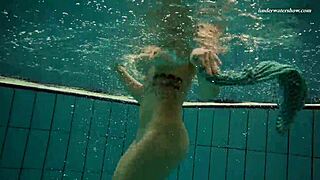 dasha submerged underwater in the pool