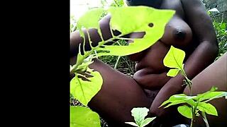 TRIBAL AFRICAN WOMAN MASTURBATES WITH DILDO IN THE WOODS, LICKING HER EBONY PUSSY