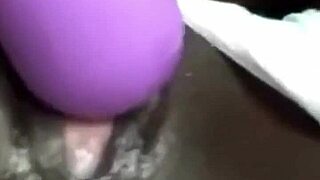 the ebony woman using a huge vibrator for solo squirting fun