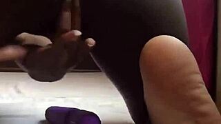 the ebony woman using a huge vibrator for solo squirting fun