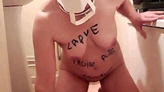 Female slave undergoes masked training session