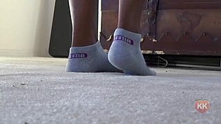 Black cougar indulges in puma socks fetish
