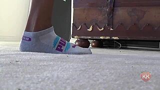 Black cougar indulges in puma socks fetish