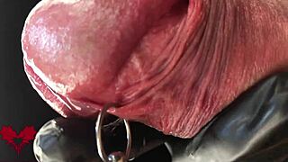 Check out this extreme close-up of latex gloves on the peehole during cumshot
