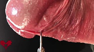 Check out this extreme close-up of latex gloves on the peehole during cumshot