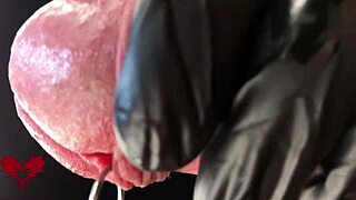 Check out this extreme close-up of latex gloves on the peehole during cumshot