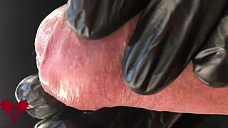 Check out this extreme close-up of latex gloves on the peehole during cumshot