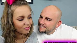 Liza Rowe, hot teen babe, struggles in sexy white shorts while getting fingered.