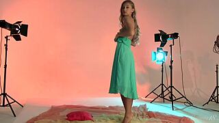 teen model with golden hair strips down for nude posing session.