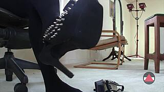 She dangles her sexy shoes seductively in a close-up solo fetish scene. Her feet tease in pantyhose.