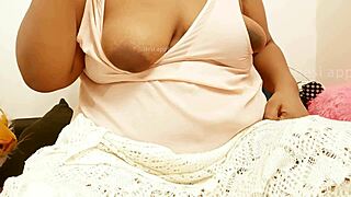 Big-boobed Indian maid on her knees for a hot scene.